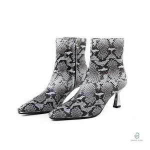 Bottines Serpent blanches et noires au design élégant