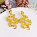 Boucles serpent chambres dorées avec perles jaunes assorties