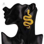 Accessoire tendance serpent avec perle jaune lumineuse