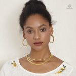 Boucles serpent en or avec cercle stylisé