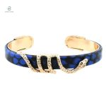 Bracelet Serpent en métal doré avec accents bleu et cuivre