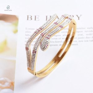 Bracelet or serpent stylé avec gemme brillante