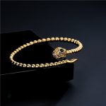 Bracelet doré serpent, finition en cuivre pour un look sophistiqué