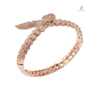 Bracelet serpent or rose avec yeux verts