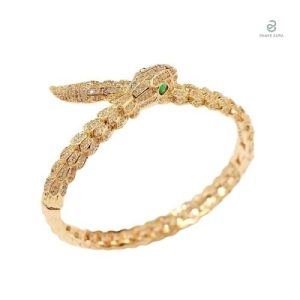 Bracelet serpent or avec yeux verts, élégant et stylé