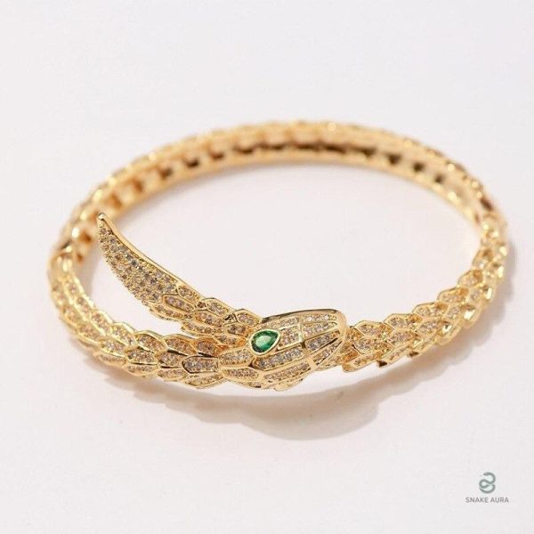 Bracelet serpent avec finition dorée et accents verts