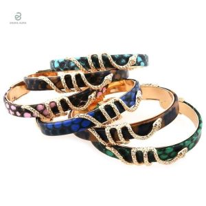 Bracelet en forme de serpent avec finition dorée et rose cuivre