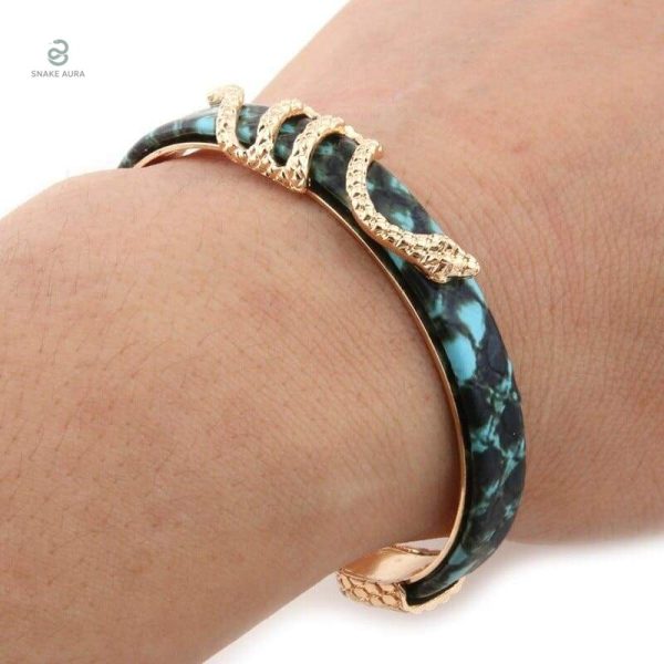Bracelet serpent en métal doré, détail vert et cuivre