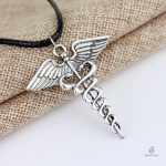 Bijou serpent Caducée, design Hermès en or et argent