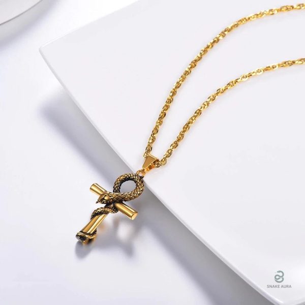 Bijou serpent en or avec symbole de croix