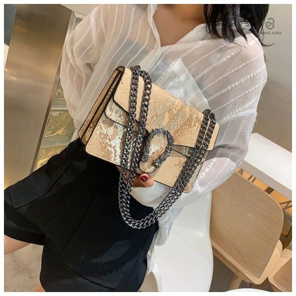 Sac Serpent avec finition dorée, design raffiné